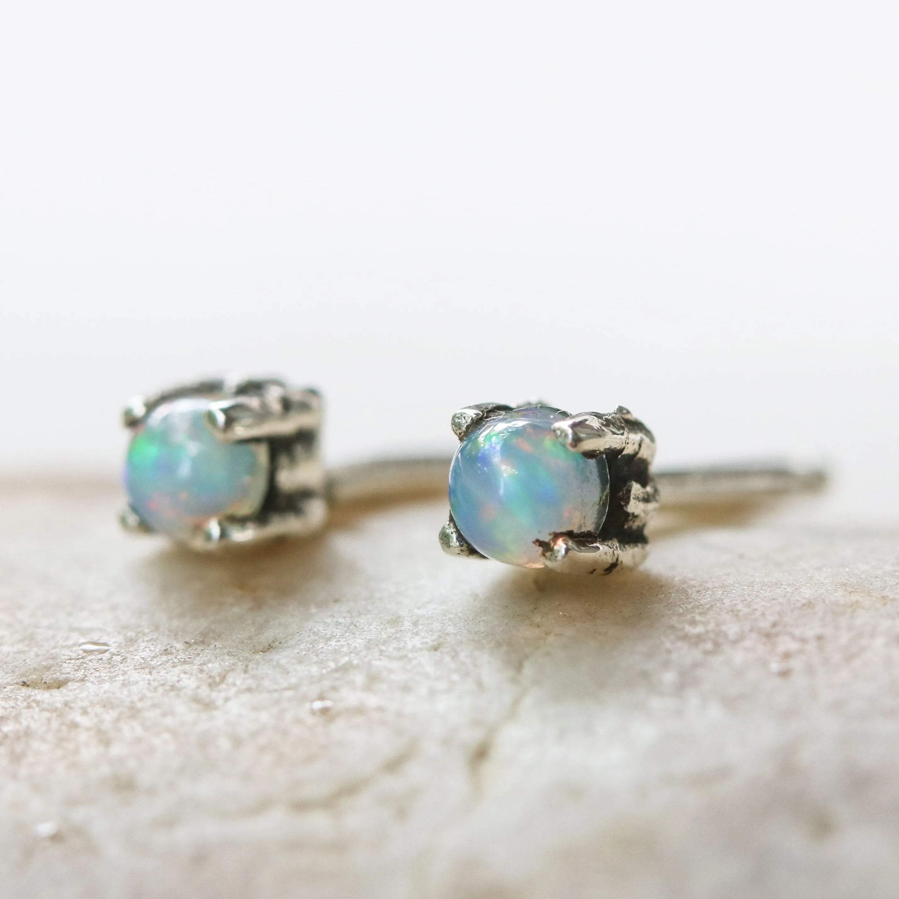 Sterling silver stud earrings with opal cabochon in prongs setting with sterling silver post and backing