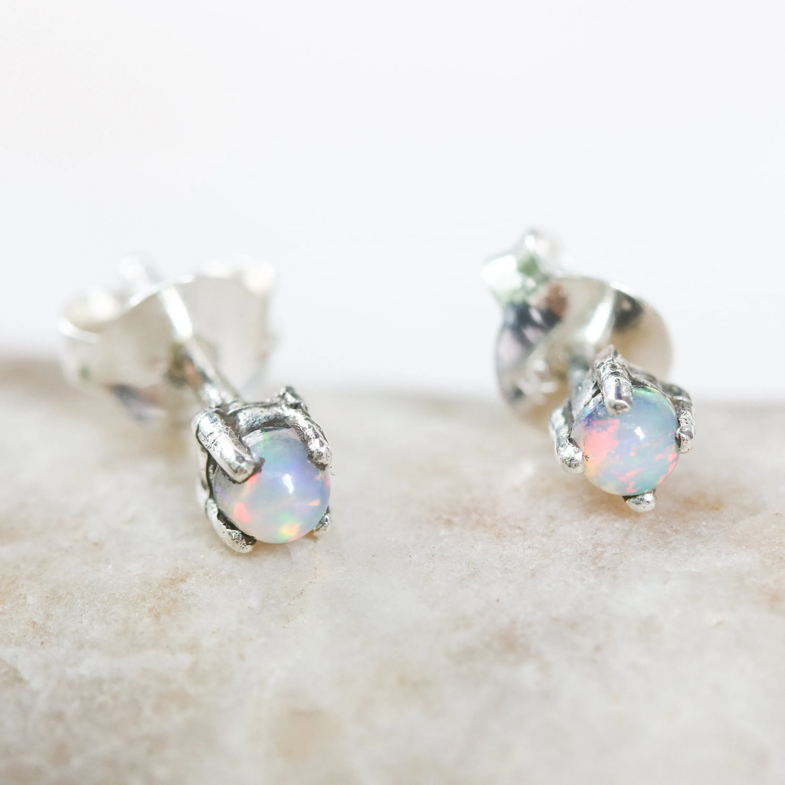 Sterling silver stud earrings with opal cabochon in prongs setting with sterling silver post and backing