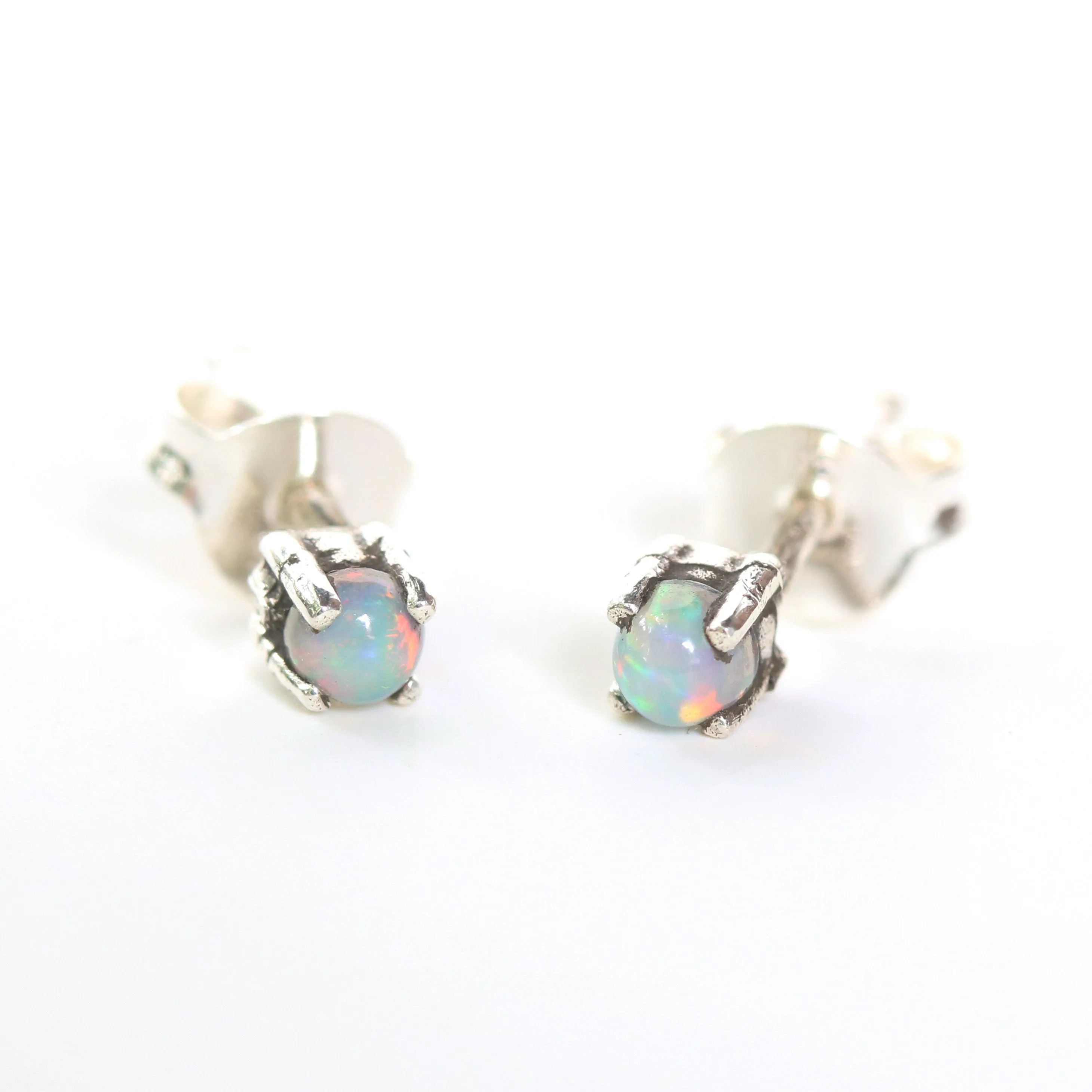 Sterling silver stud earrings with opal cabochon in prongs setting with sterling silver post and backing