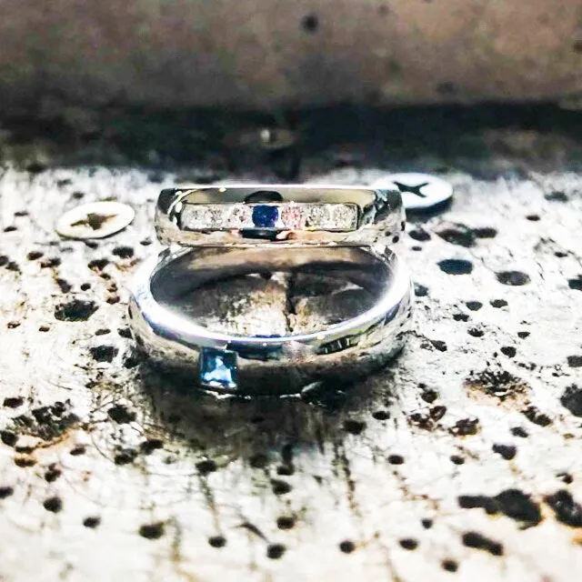 Wedding band set his and hers with blue sapphire and diamonds on white gold in high polished band